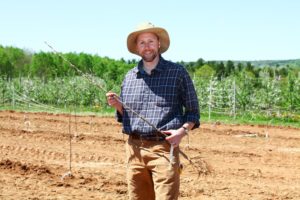 Sean Myles in apple orchard